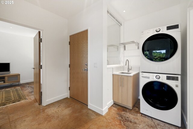 13440 SW Mccabe Chapel Rd, Mcminnville, OR 97128 - washroom with stacked washer / dryer, a sink, and baseboards