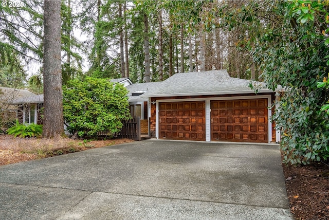 garage featuring driveway