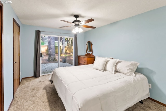 bedroom featuring baseboards, ceiling fan, access to exterior, a textured ceiling, and light carpet