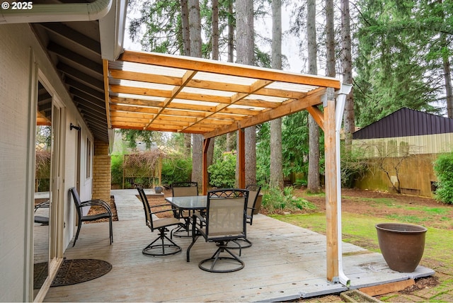 view of patio / terrace featuring outdoor dining area, a deck, and a pergola