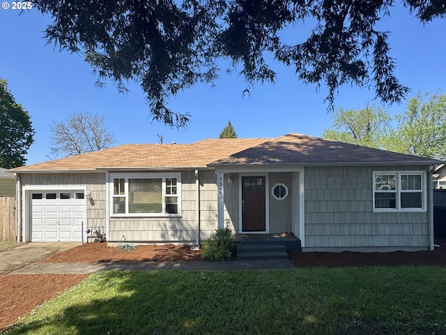 ranch-style house featuring a garage, a front lawn, concrete driveway, and roof with shingles