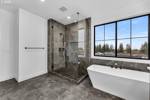 full bathroom featuring visible vents, baseboards, a soaking tub, marble finish floor, and a stall shower