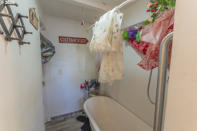 bathroom with a soaking tub