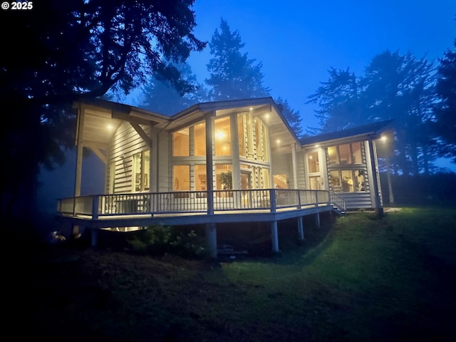 31640 Spruce Dr, Gold Beach, OR 97444 - back of property featuring a sunroom and a wooden deck