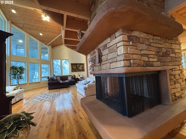 31640 Spruce Dr, Gold Beach, OR 97444 - living room with light wood finished floors, wood ceiling, high vaulted ceiling, and a fireplace