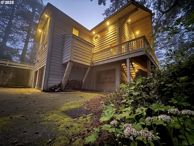 31640 Spruce Dr, Gold Beach, OR 97444 - view of home's exterior with a balcony and an attached garage