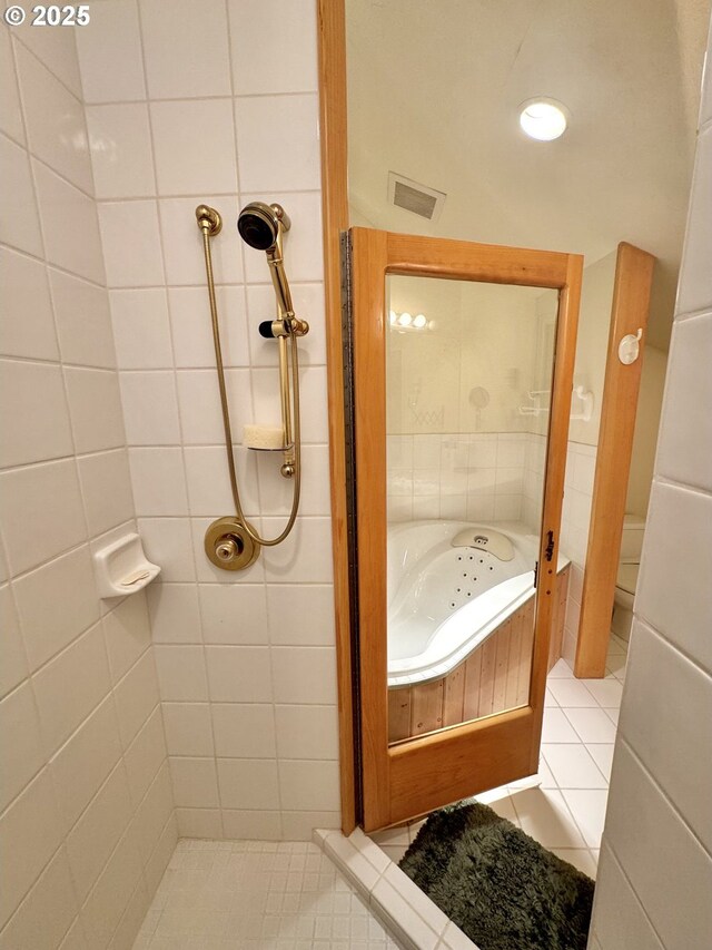 31640 Spruce Dr, Gold Beach, OR 97444 - bathroom featuring tile patterned floors, a whirlpool tub, tiled shower, and visible vents