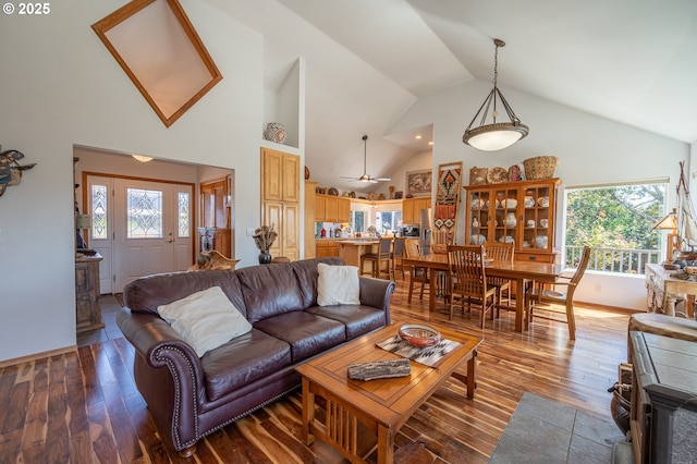 living room featuring high vaulted ceiling, ceiling fan, and hardwood / wood-style flooring