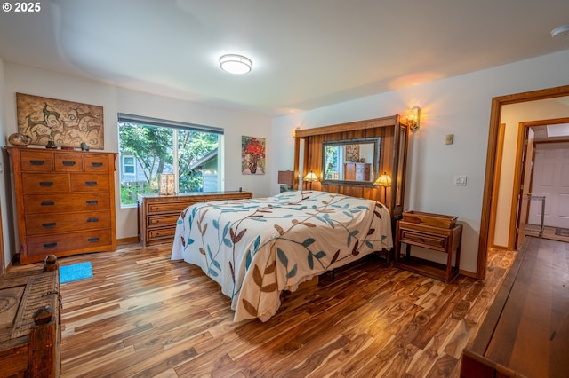 bedroom featuring wood finished floors