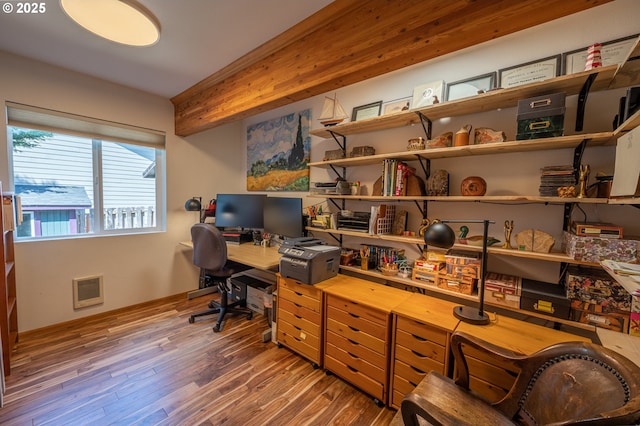 office area featuring baseboards and wood finished floors