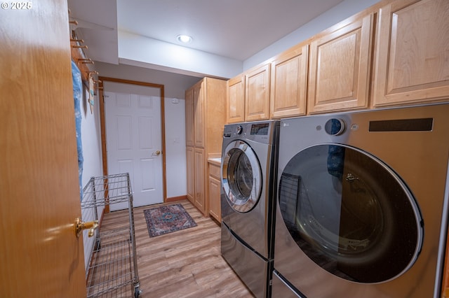 laundry area featuring washer and dryer, baseboards, light wood-type flooring, recessed lighting, and cabinet space