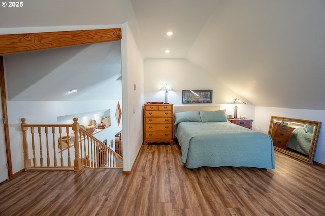 bedroom featuring baseboards, vaulted ceiling, recessed lighting, and wood finished floors
