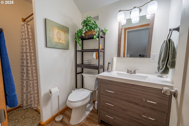 full bath with a shower with curtain, visible vents, wood finished floors, vanity, and toilet
