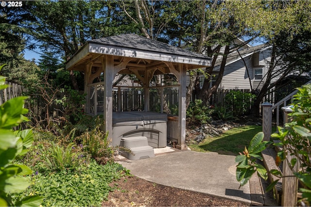 surrounding community featuring a hot tub, a patio, a gazebo, and fence