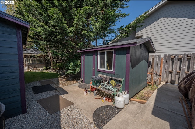 view of shed with a fenced backyard