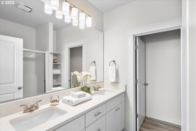 bathroom with hardwood / wood-style flooring and vanity