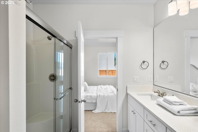 bathroom featuring walk in shower and vanity