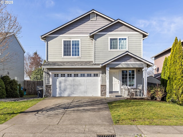 view of front of home featuring a porch, concrete driveway, fence, a garage, and a front lawn