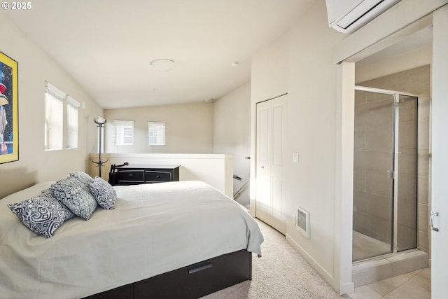 bedroom with visible vents, carpet flooring, and a wall mounted air conditioner