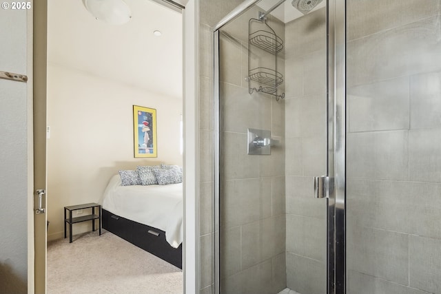 ensuite bathroom featuring a shower stall and connected bathroom