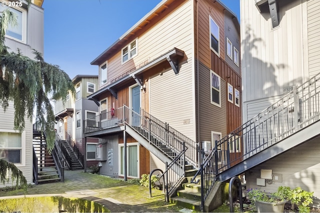 view of property featuring stairway