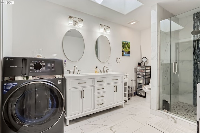 16500 SW Satterberg Rd, Beaverton, OR 97007 - bathroom with washer / dryer, marble look tiles, a skylight, a marble finish shower, and toilet
