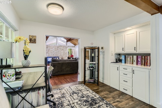 16500 SW Satterberg Rd, Beaverton, OR 97007 - dining space featuring dark wood finished floors and a textured ceiling