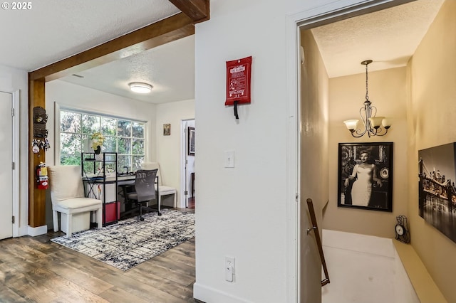 16500 SW Satterberg Rd, Beaverton, OR 97007 - hall with a textured ceiling, a chandelier, wood finished floors, a desk, and beam ceiling