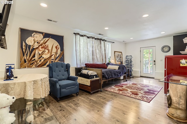 16500 SW Satterberg Rd, Beaverton, OR 97007 - bedroom featuring wood finished floors, recessed lighting, and access to exterior