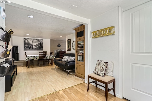 16500 SW Satterberg Rd, Beaverton, OR 97007 - living room featuring wood finished floors, a textured ceiling, and recessed lighting