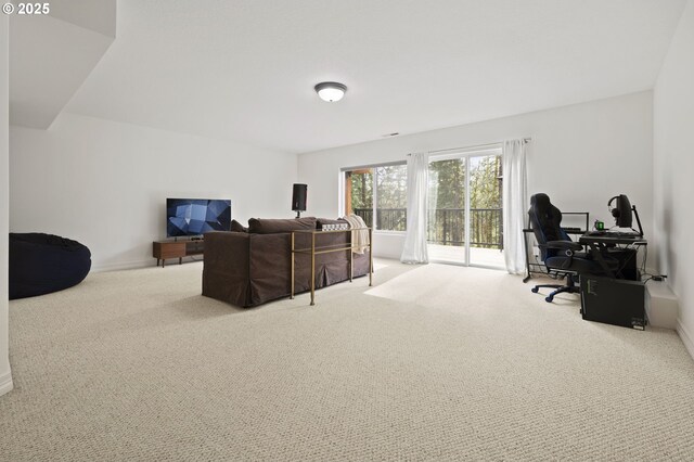interior space featuring carpet flooring and baseboards