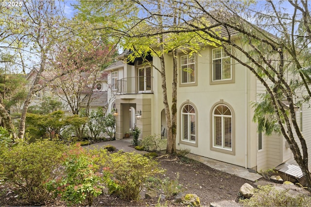 view of side of home featuring stucco siding