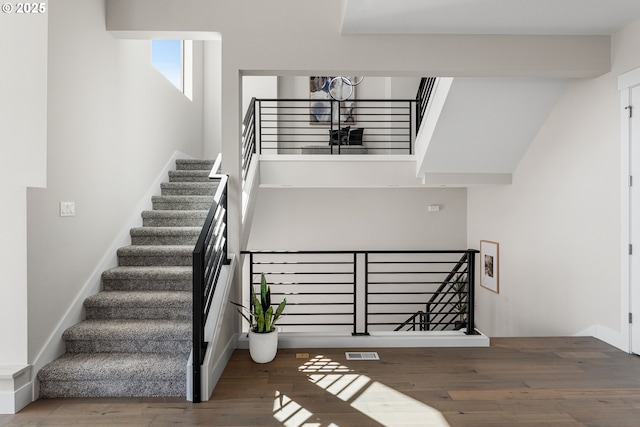 565 W U St, Washougal, WA 98671 - stairs featuring baseboards, visible vents, and wood finished floors