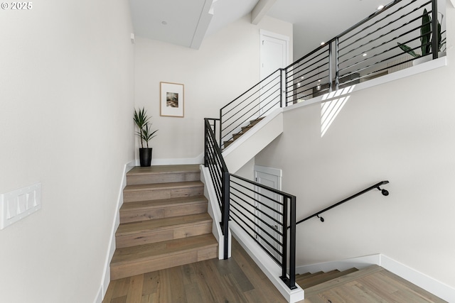 565 W U St, Washougal, WA 98671 - stairway featuring baseboards, a towering ceiling, and wood finished floors