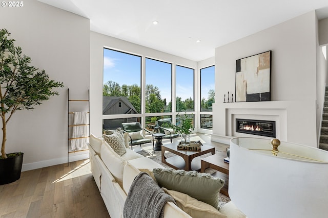 565 W U St, Washougal, WA 98671 - living area with recessed lighting, a glass covered fireplace, plenty of natural light, and hardwood / wood-style flooring