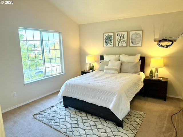 carpeted bedroom featuring vaulted ceiling