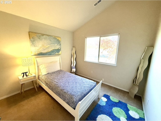 bedroom featuring lofted ceiling and carpet floors