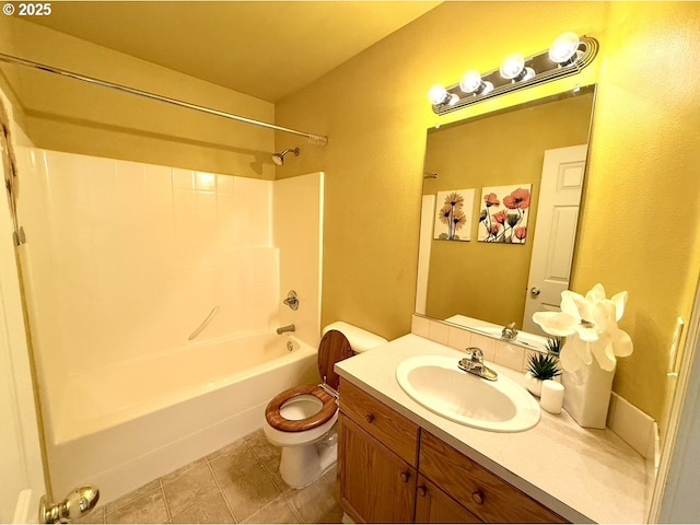 full bathroom featuring toilet, vanity, and  shower combination