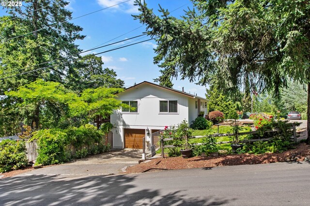 6985 SW Florence Ln, Portland, OR 97223 - view of front facade with an attached garage and driveway