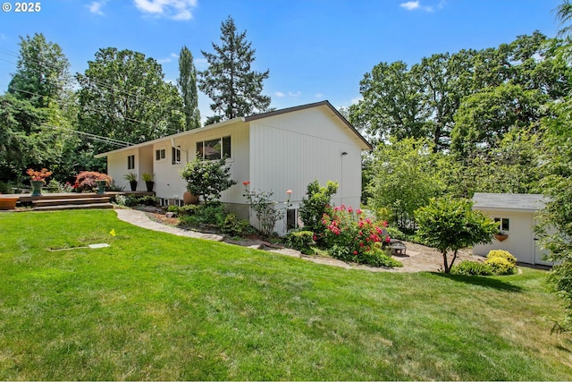6985 SW Florence Ln, Portland, OR 97223 - view of home's exterior featuring a lawn