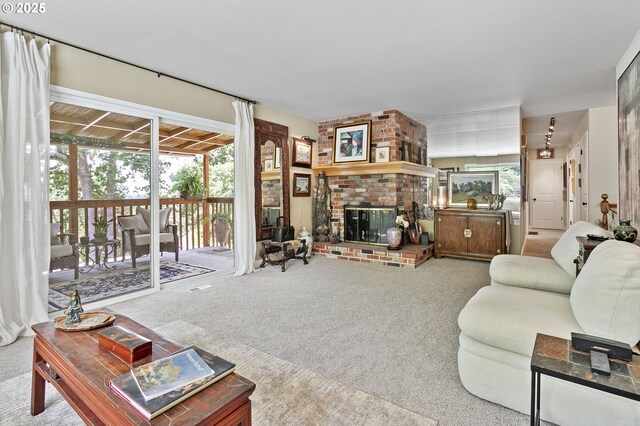 6985 SW Florence Ln, Portland, OR 97223 - carpeted living room featuring a brick fireplace