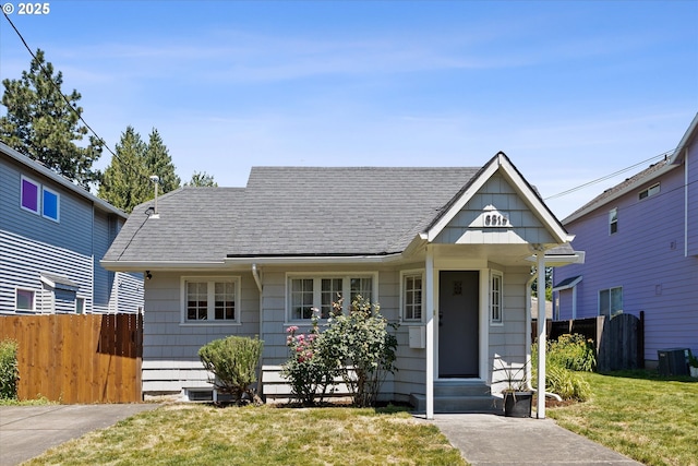 6815 N Smith St, Portland, OR 97203 - view of front of house featuring entry steps, central AC, and a shingled roof