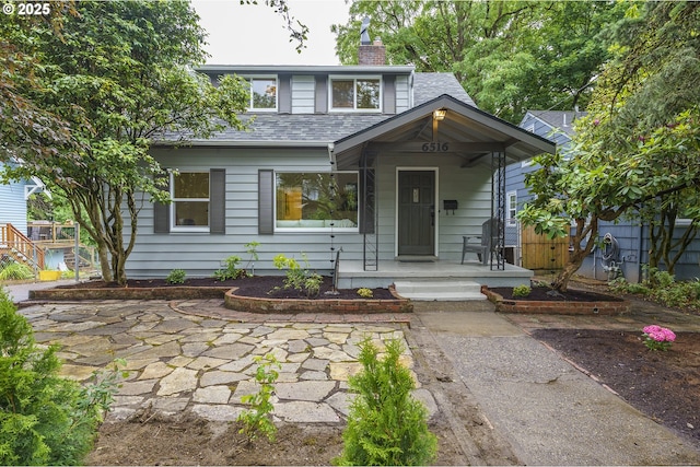 6516 SE 17th Ave, Portland, OR 97202 - view of front facade with a chimney, a shingled roof, and a porch