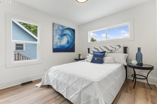 6516 SE 17th Ave, Portland, OR 97202 - bedroom featuring wood finished floors and baseboards