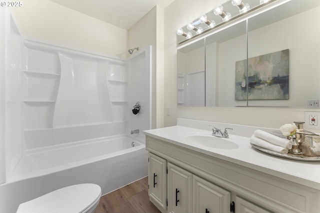 6516 SE 17th Ave, Portland, OR 97202 - bathroom featuring vanity, toilet, tub / shower combination, and wood finished floors