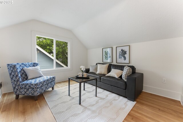 6516 SE 17th Ave, Portland, OR 97202 - living room featuring lofted ceiling, light wood-style floors, and baseboards