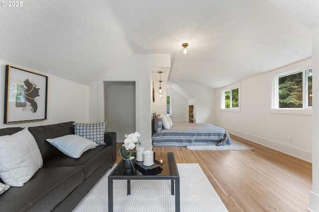 6516 SE 17th Ave, Portland, OR 97202 - bedroom featuring vaulted ceiling, wood finished floors, and baseboards