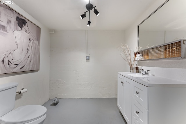 6516 SE 17th Ave, Portland, OR 97202 - bathroom with vanity, toilet, and concrete floors