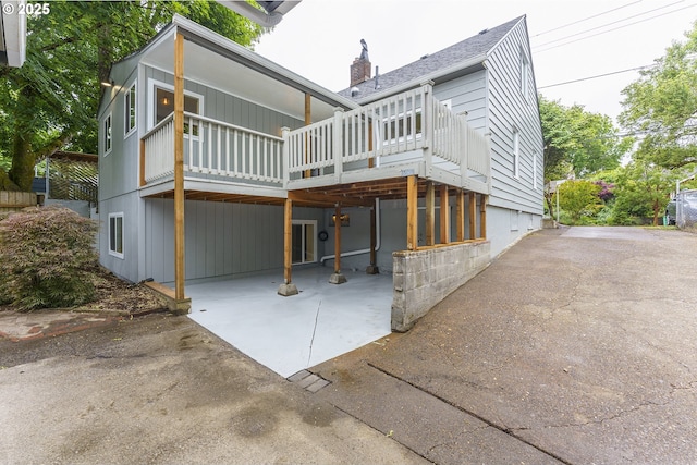 6516 SE 17th Ave, Portland, OR 97202 - back of house with a chimney, a patio area, and a deck