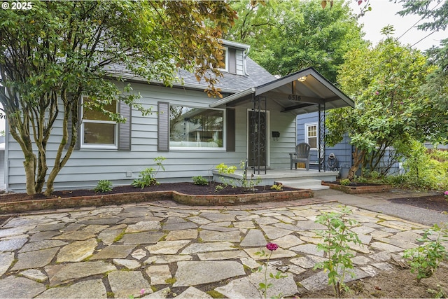 6516 SE 17th Ave, Portland, OR 97202 - view of front of property with covered porch and a shingled roof